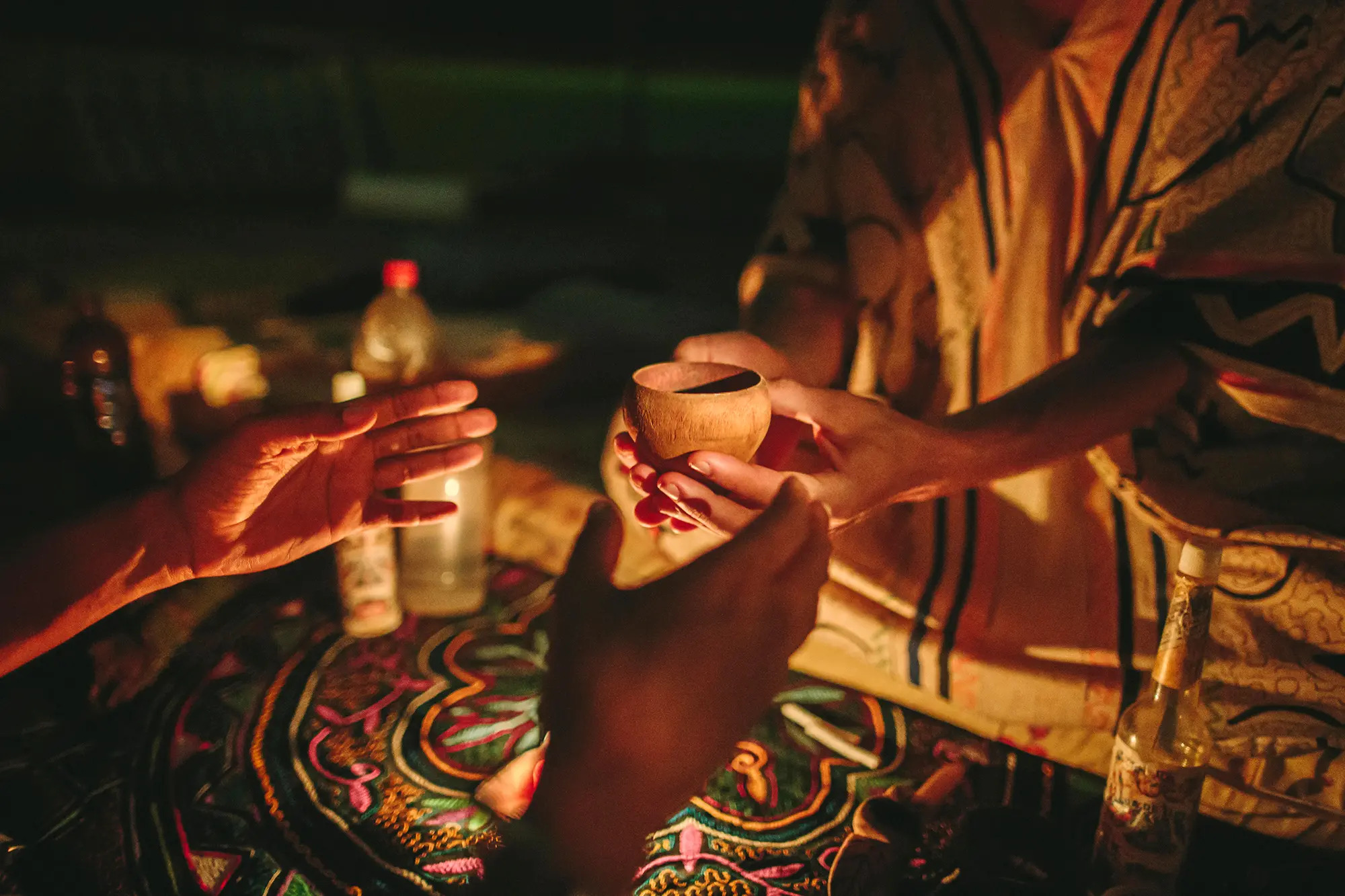 Ritualistic cup and medicine preparation for therapeutic exploration and mindful intention setting.